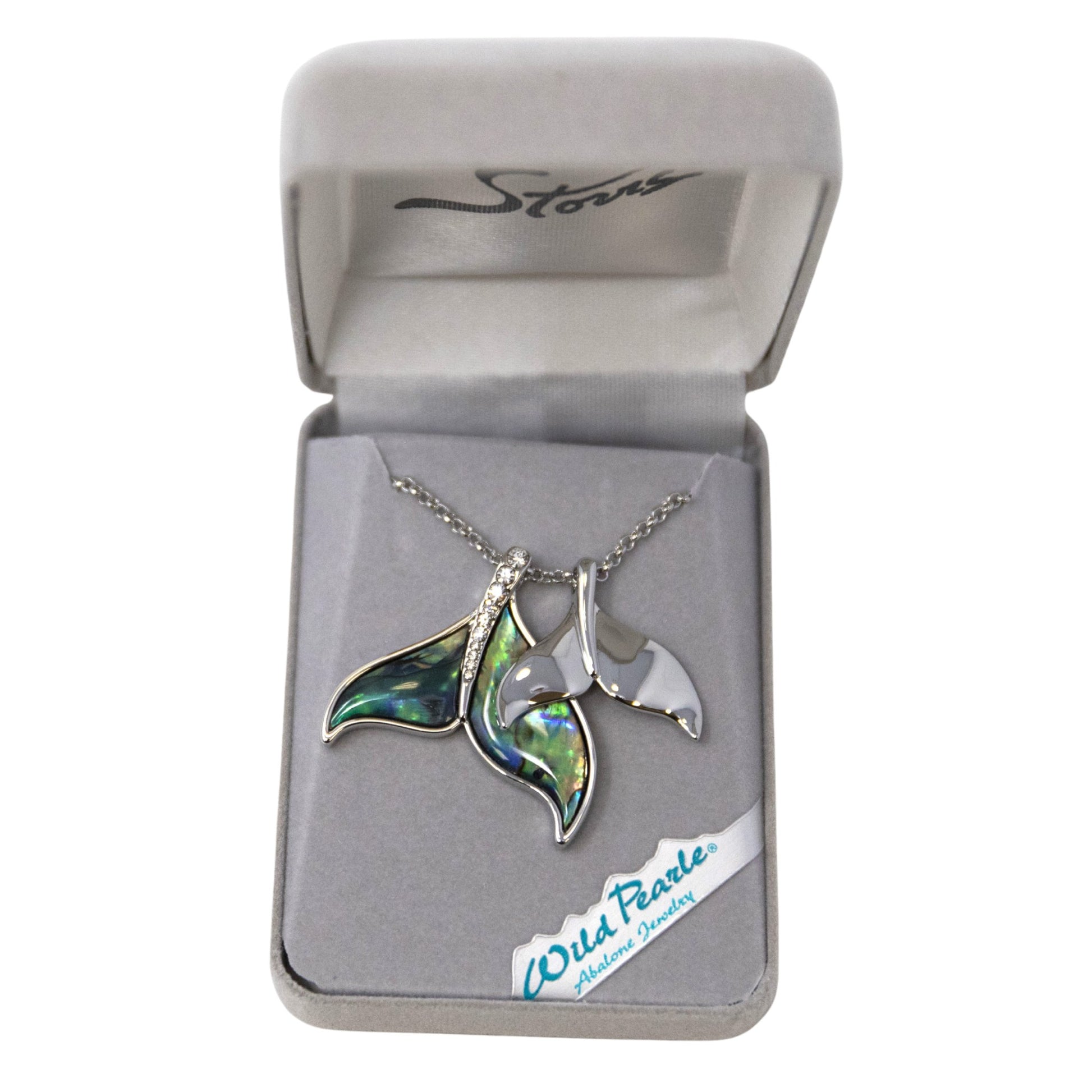 Jewelry box with a necklace featuring green and silver whale tails