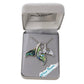 Jewelry box with a necklace featuring green and silver whale tails