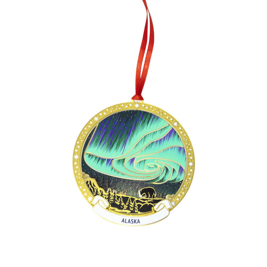 Brass ornament featuring the northern lights