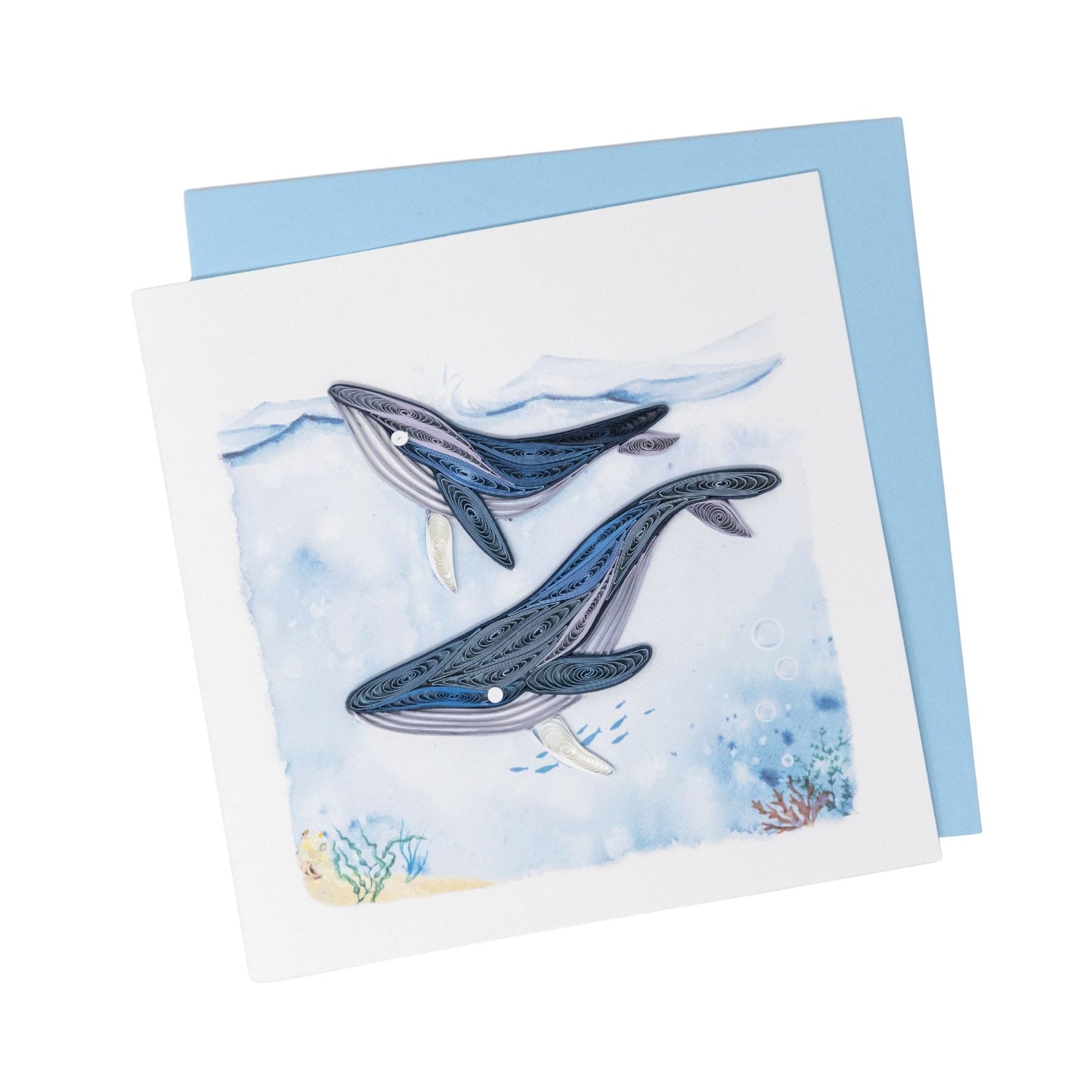 Greeting card with two whale illustrations on a blue watercolor background