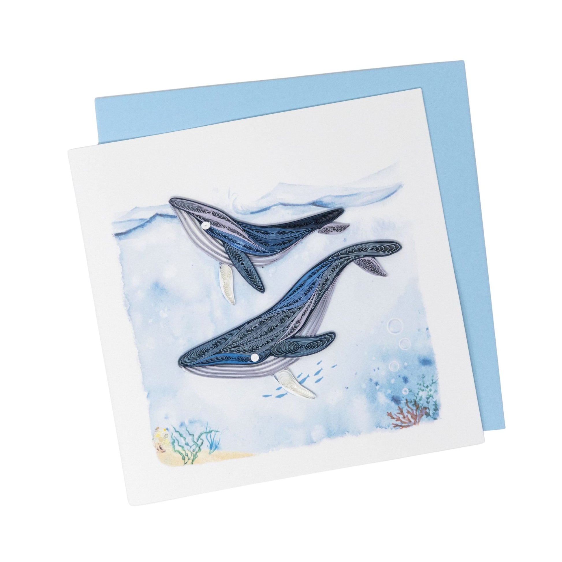 Greeting card with two whale illustrations on a blue watercolor background