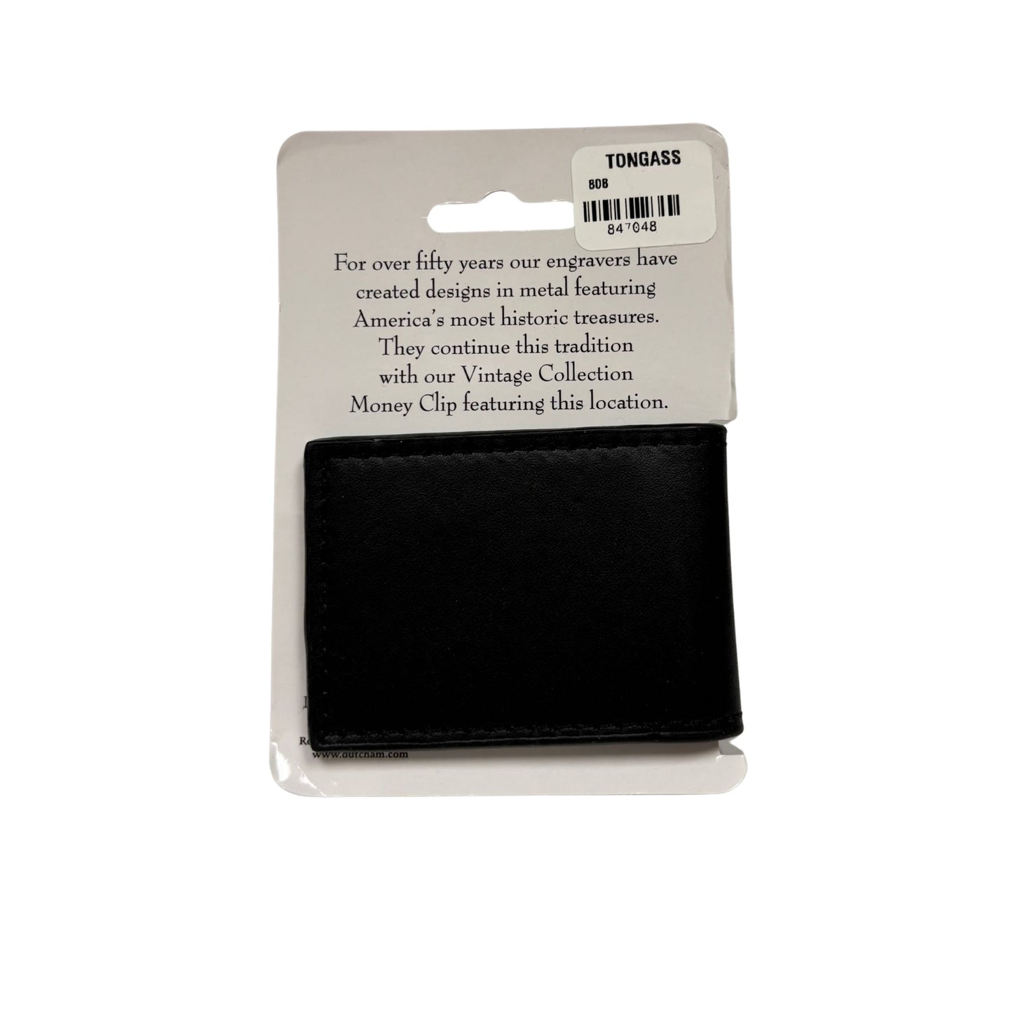 Black money clip on a white background with a TONGASS label.