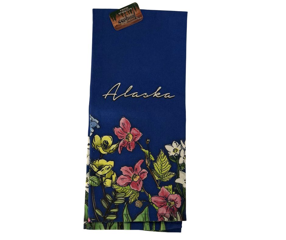 Floral towel with 'Alaska' text on blue fabric on a white background