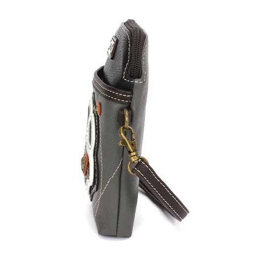 Side view of a gray crossbody bag with decorative elements and a strap on a white background