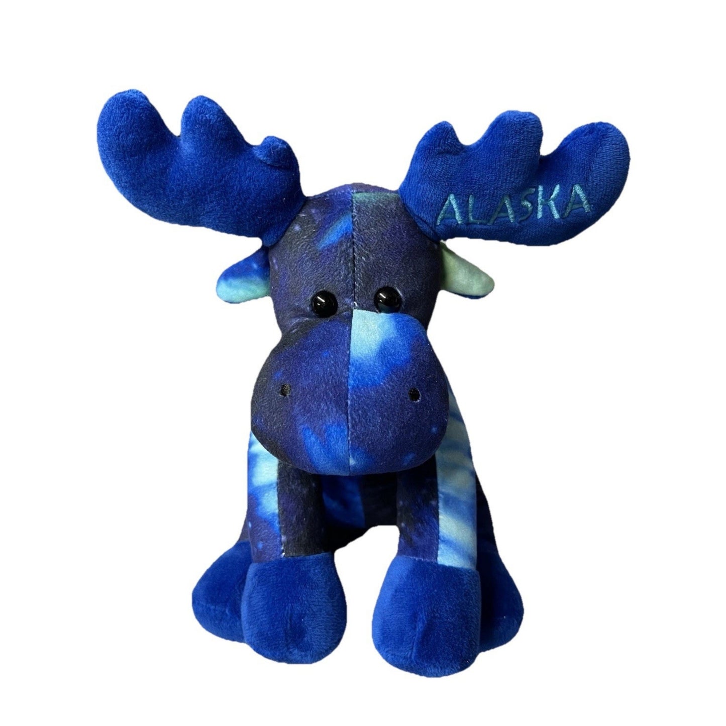 Blue plush moose toy with 'Alaska' text on a white background