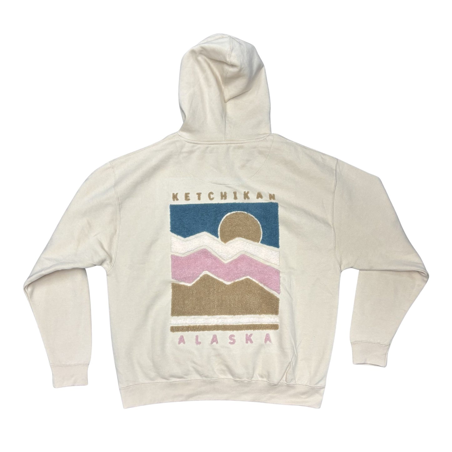 Beige hoodie with fluffy mountain graphic and 'Ketchikan Alaska' text 