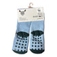Pair of blue socks with black dots and sole pattern
