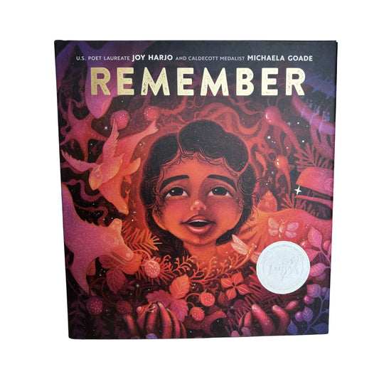 Book cover of 'Remember' with a child's face and nature elements on a dark background