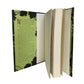 Open book with green floral design