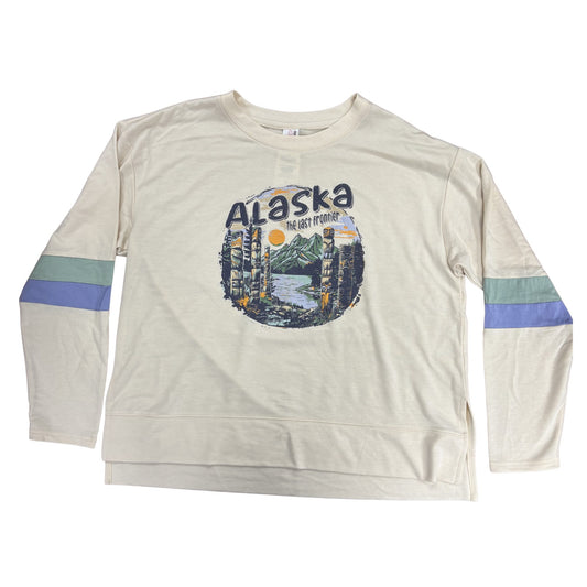 Beige long-sleeve shirt with 'Alaska' graphic design on a white background