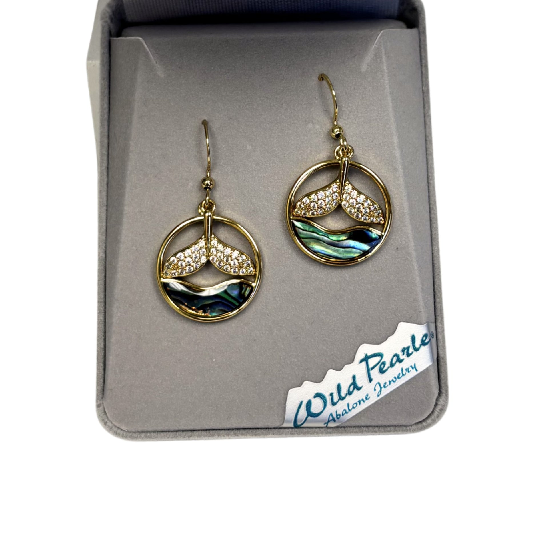 Gold and abalone earrings in a Wild Pearle box on a white background
