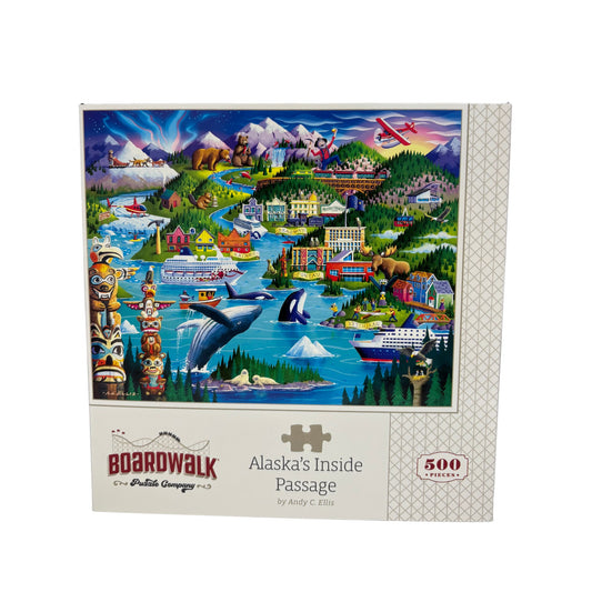 Puzzle box featuring a scenic illustration of Alaska's Inside Passage with various elements like mountains, boats, and animals.