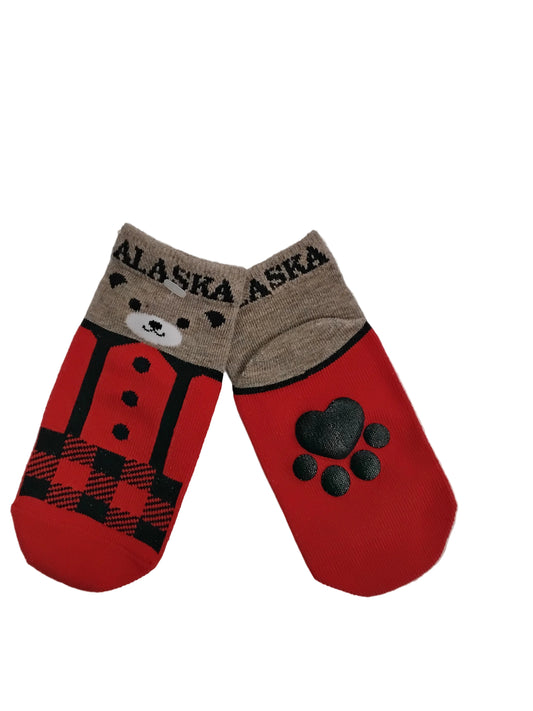 Red and brown Alaska-themed socks with paw prints on the back and a cute bear face on the front on a white background