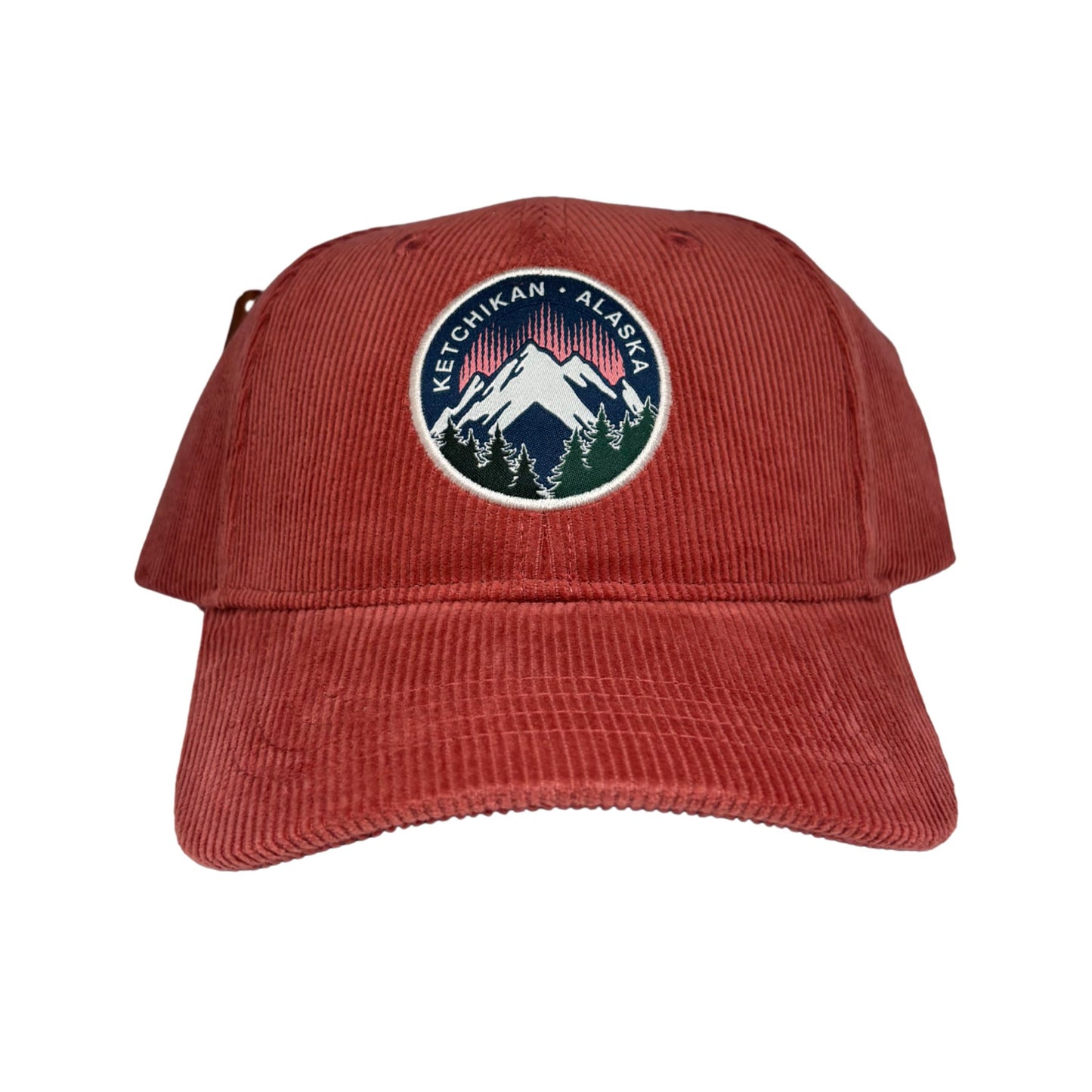 Red cap with a mountain logo and text 