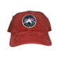 Red cap with a mountain logo and text 