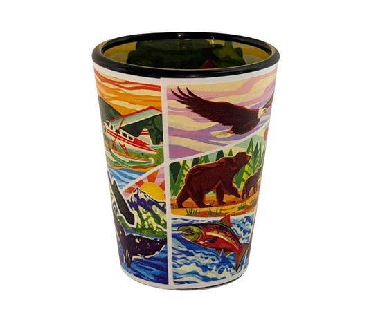 Colorful shot glass with nature-themed design featuring animals and landscapes.