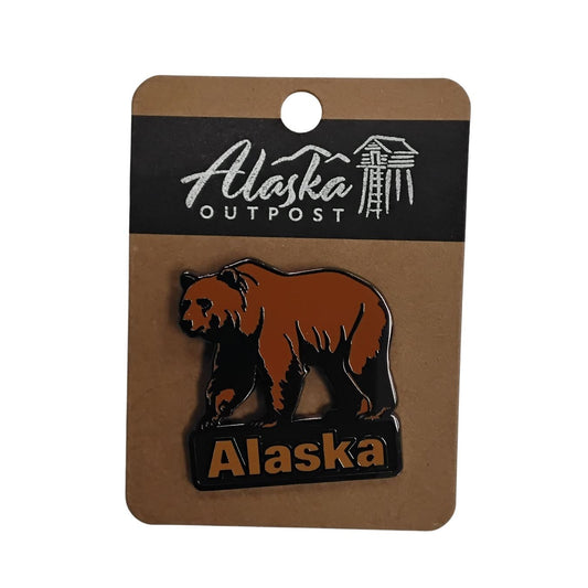 Alaska-themed pin with bear design on a card labeled 'Alaska Outpost' against a white background