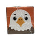 Square puzzle cube with a cartoon eagle design 