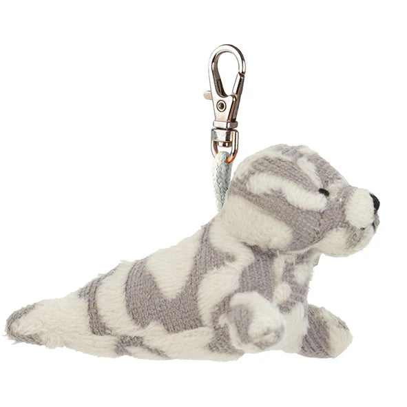 Plush seal toy with a keychain clip on a white background