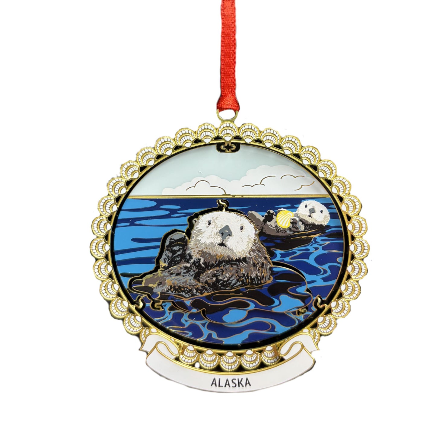 Ornament featuring an otter and Alaska text