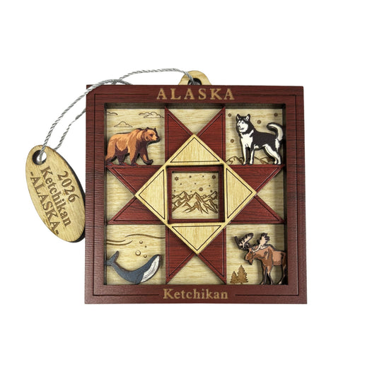 Decorative Alaska ornament with nature-themed designs and 'Ketchikan' tag.