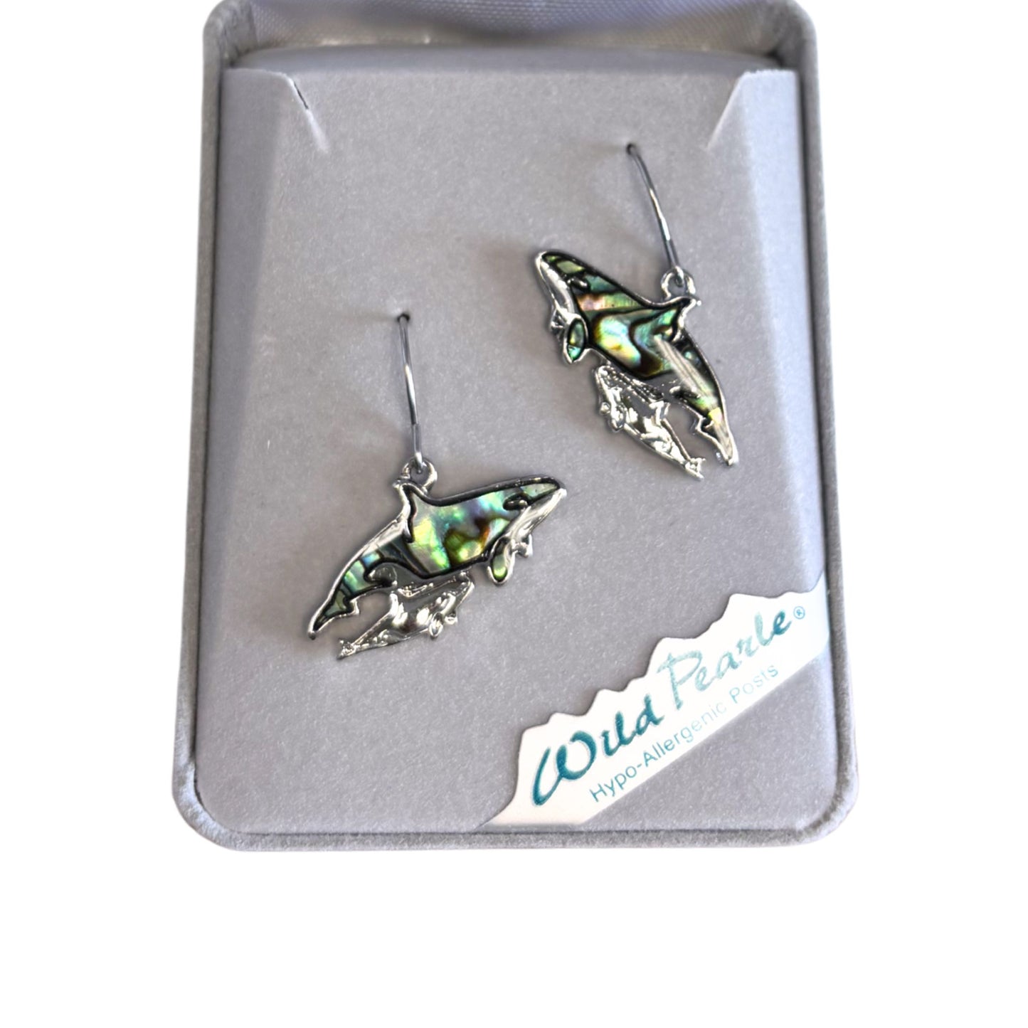 orca shaped earrings in a 'Wild Pearle' box on a white background