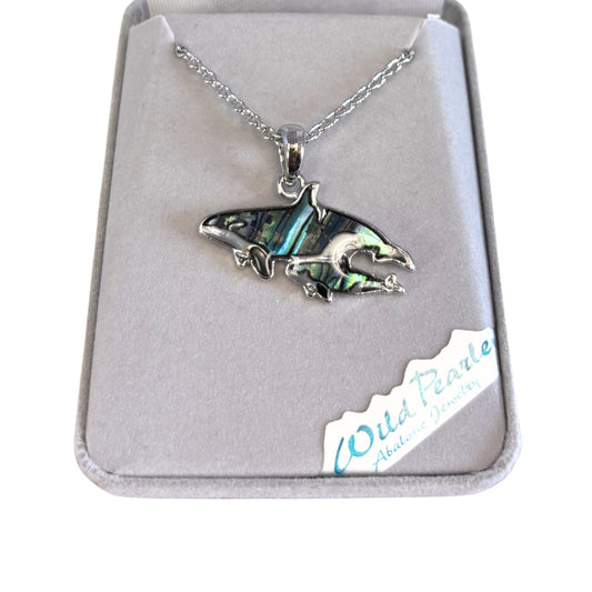 Silver orca pendant necklace in a jewelry box with 'Wild Pearle' branding.