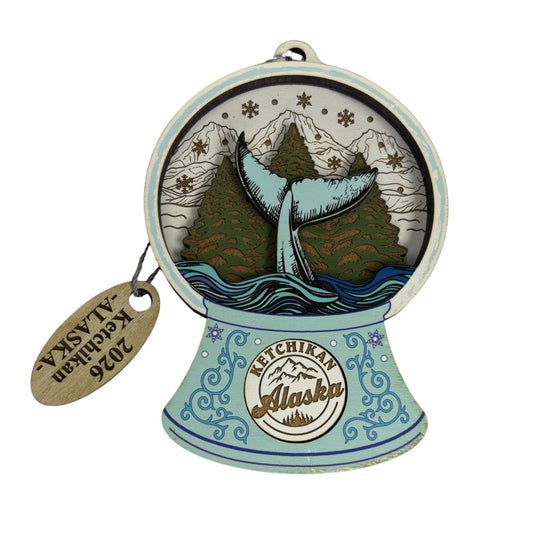 Decorative ornament with whale design and 'Ketchikan Alaska' text