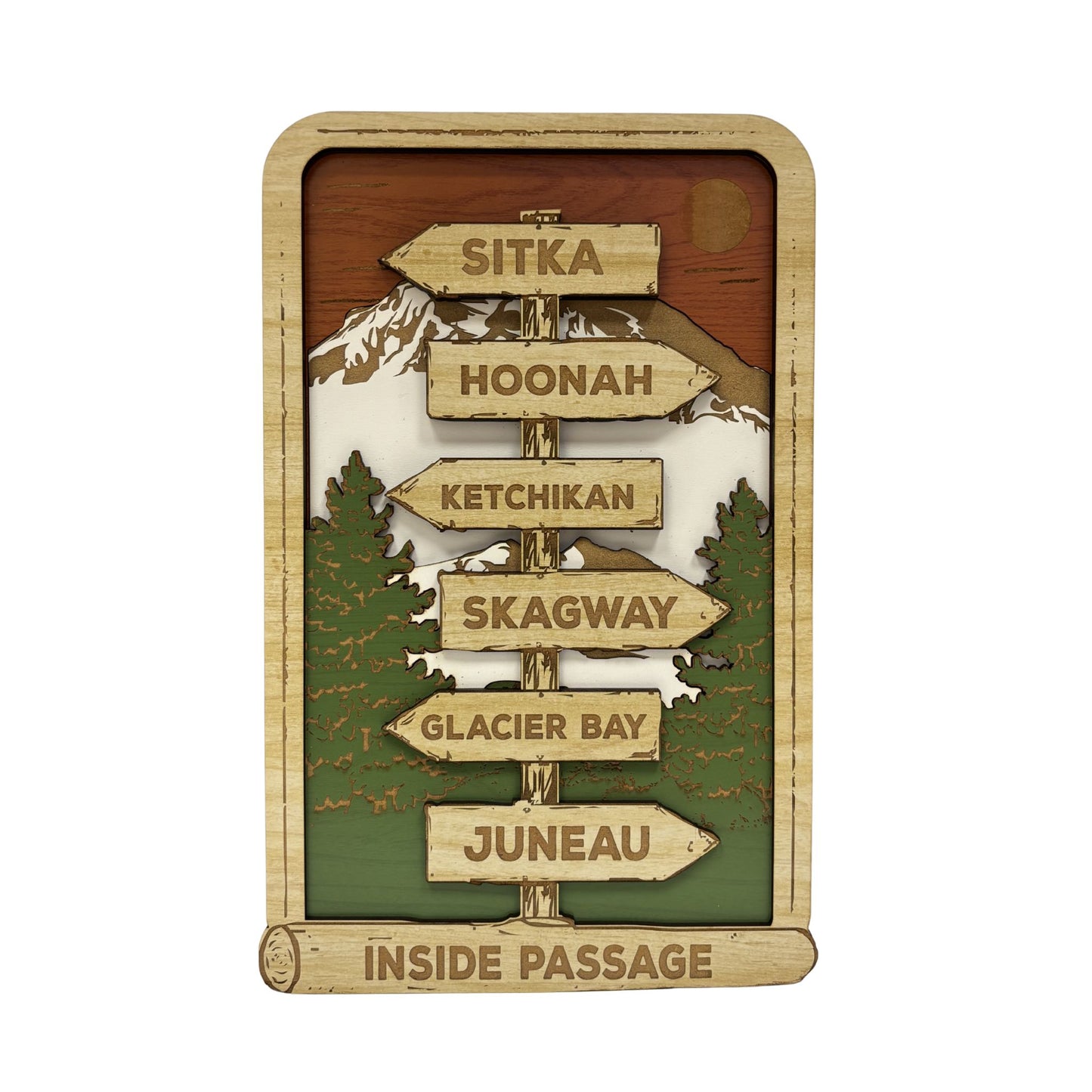 Wooden sign with directional arrows to various Alaska cities on a white background