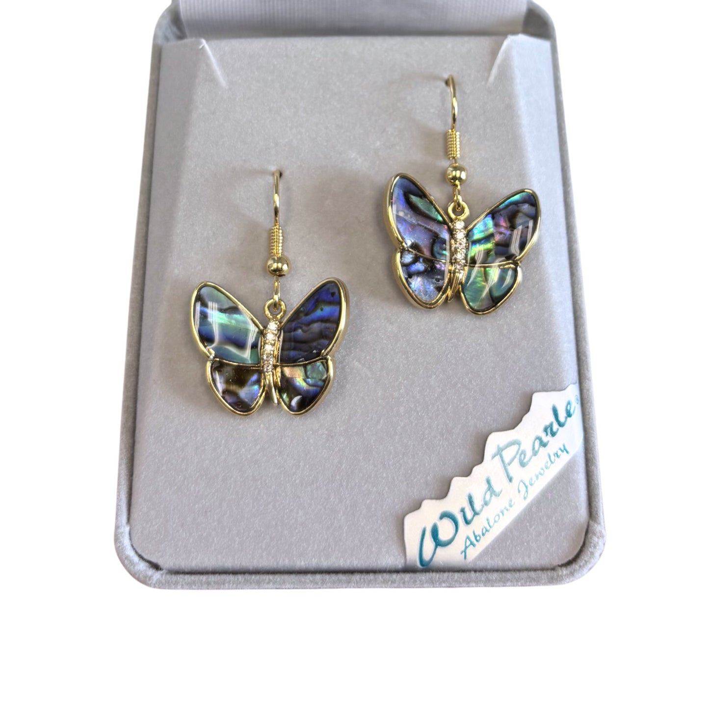 Butterfly-shaped earrings in a box with 'Wild Pearle' branding.