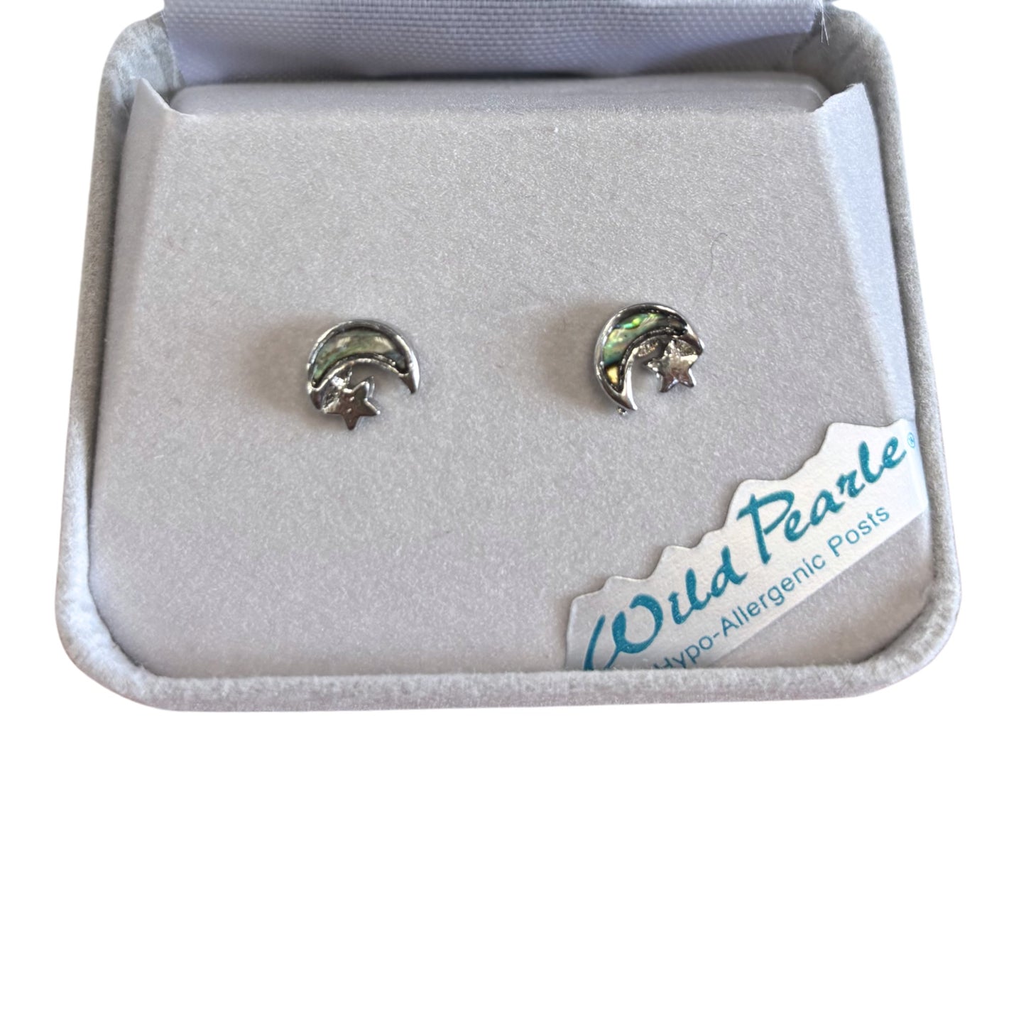 Silver earrings with moon and star design in a 'Wild Pearle' box.