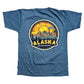 Blue t-shirt with Alaska graphic design on a white background