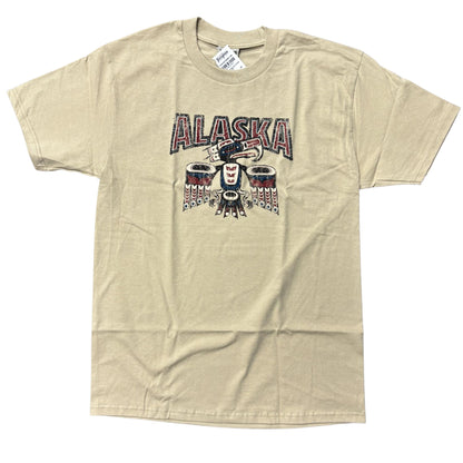 Beig T-shirt with a totemic eagle design and Alaska text