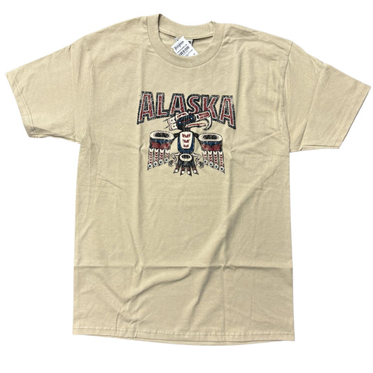 Beig T-shirt with a totemic eagle design and Alaska text