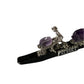 Decorative item with purple gemstones and 'Alaska' text on a white background