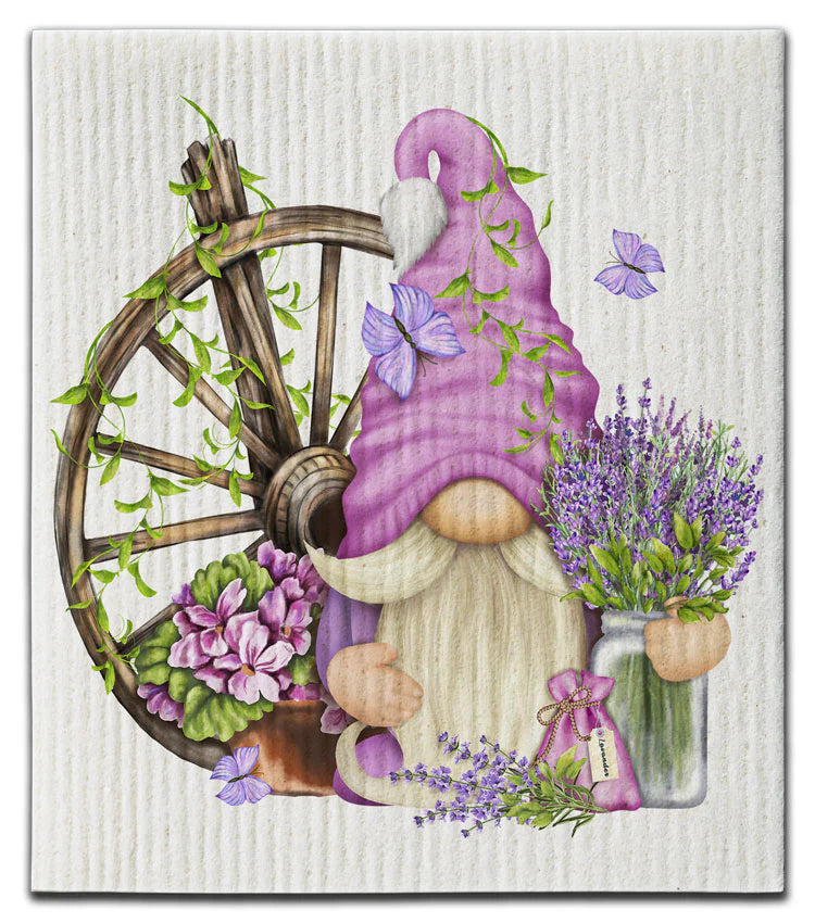 Eco dishcloth with Gnome with a purple hat and lavender flowers next to a wooden wheel 