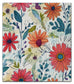 Colorful floral dish cloth with red, orange, and pink flowers on a textured background