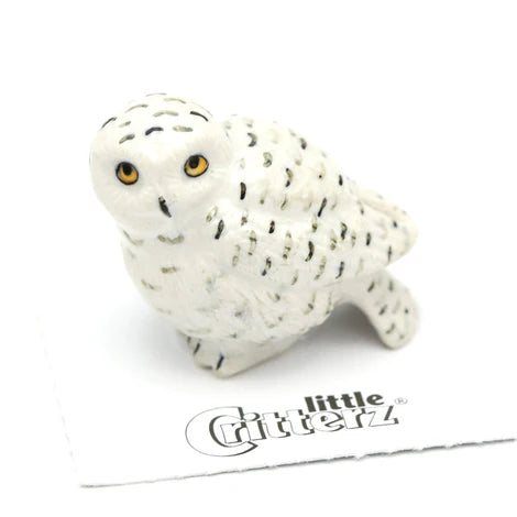 White owl figurine with black spots on a white background, branded 'little Critterz'.