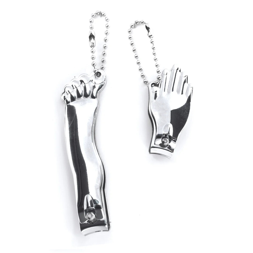 Metallic foot and hand nail clippers on a white background