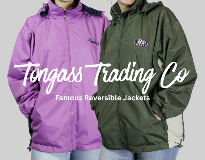 Two reversible jackets, one purple and one green, with 'Tongass Trading Co' branding.
