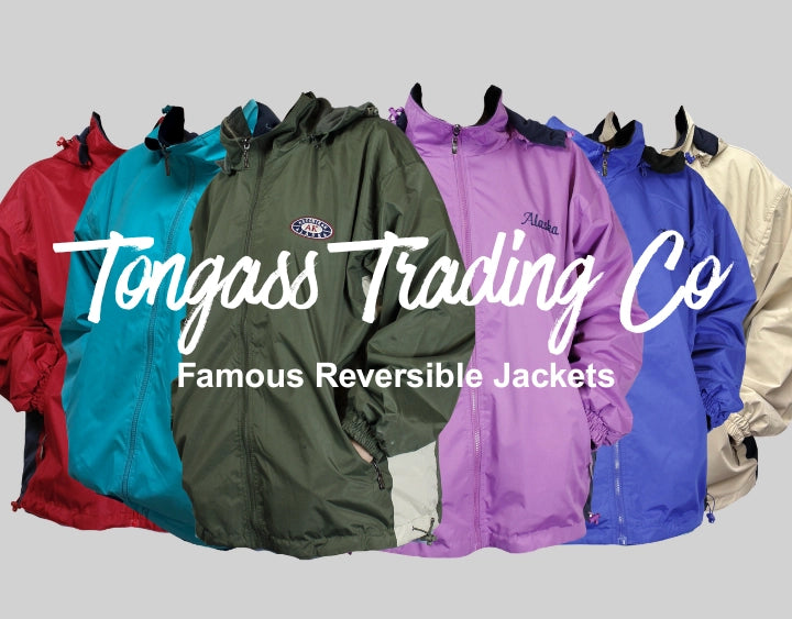 Colorful reversible jackets displayed with Tongass Trading Co branding on a gray background