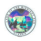 Sticker with bear silhouette, forest, the northern lights and 'Land of the Midnight Sun, Alaska' 