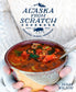 Bowl of soup held by a person with 'The Alaska From Scratch Cookbook' in the background