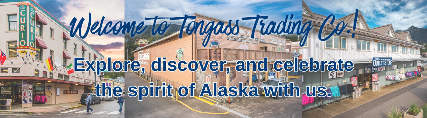 Promotional banner for Tongass Trading Co. with a scenic view of a town street.