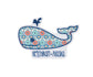 Decorative whale-shaped sticker with a pattern and 'Ketchikan, Alaska' text 