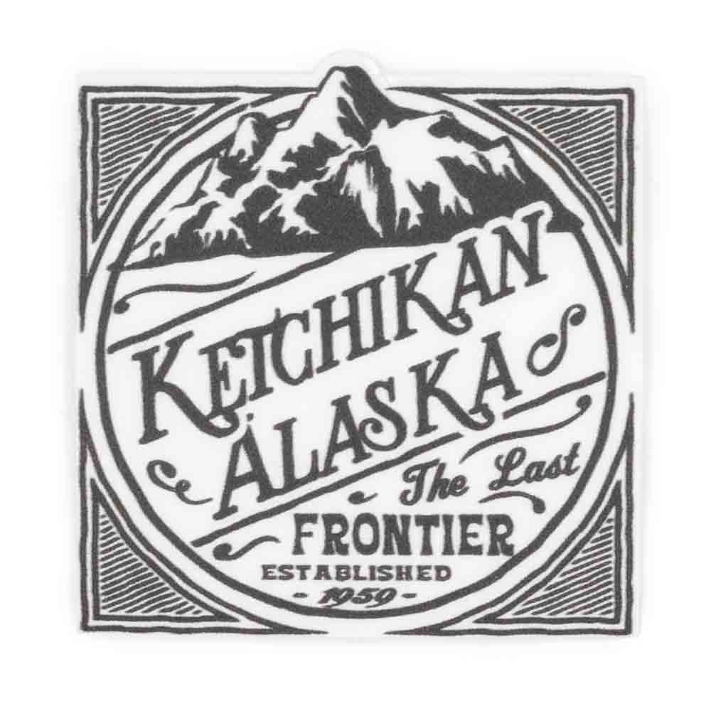 Black text of Ketchikan, Alaska with mountain illustrations sticker