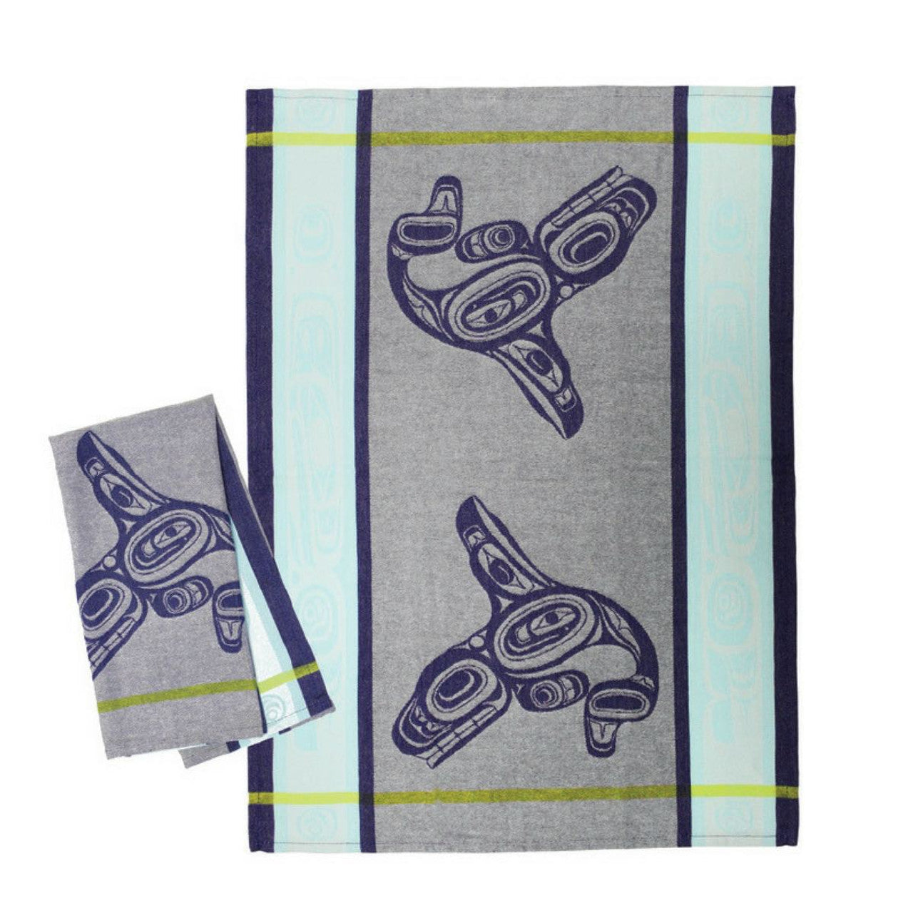 Towel with blue whale design on a gray and light blue striped background