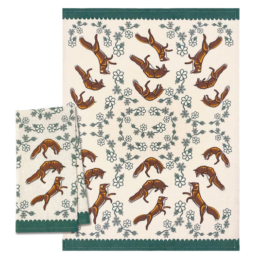 Set of two patterned tea towels with fox design on a white background